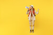 © ViDi Studio - Full body winner fun young woman carry bag with stuff mat scream in megaphone isolated on plain yellow background Tourist lead active lifestyle walk on spare time Hiking trek rest travel trip concept.