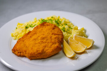 Wall Mural - Chicken cutlet with couscous and lemon