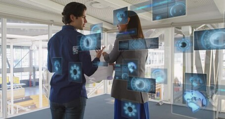 Poster - Animation of gloves, radars, computer language over caucasian coworkers discussing in office