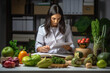 Woman dietitian in medical uniform working on a diet plan with different healthy food ingredients in the green office lab. Weight loss and nutrition concept.