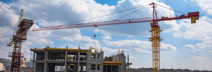 Cranes and building construction site