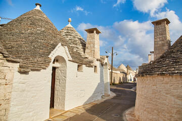 Canvas Print - Generic view of Alberobello with trulli roofs and terraces, Apulia region