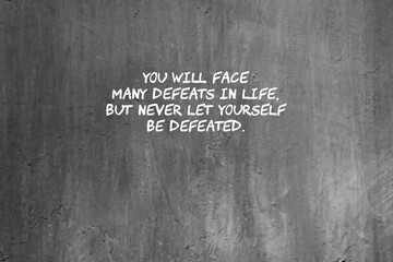 Wall Mural - Concrete wall with life inspirational text - You will face many defeats in life but never let yourself be defeated