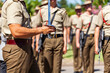 © Austockphoto - Australian army soldier with sword drawn for Freedom of Entry ceremony beside troops