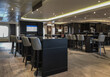 Luxurious elegant bar, lounge or coffee shop in cozy living room interior design with sofas, arm chairs and loungers onboard classic cruiseship cruise ship liner