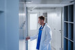 © makedonski2015 - A male surgeon opens his locker in the hospital locker room after a work shift. End of the working day.