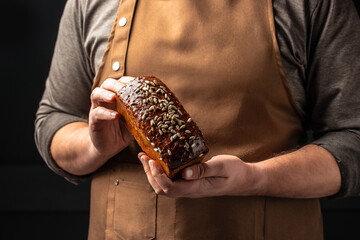 Wall Mural - Wheat square bread in hands, domestic cozy bakery pastry. Healthy food concept. place for text