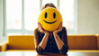 © Tech Hendra - Woman holding smile icon which is yellow color.