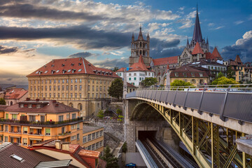 Wall Mural - Cityscape image of downtown Lausanne, Switzerland during sunset.