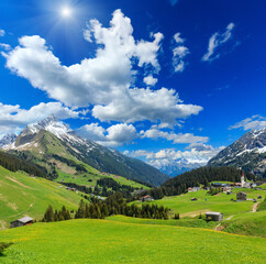 Wall Mural - Summer mountain  sunshiny view to Biberkopf mount (Warth, Vorarlberg, Austria) and deep blue sky with clouds.