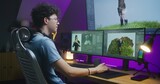 Fototapeta  - Young 3D designer draws video game character, creates animation. Teenager works remotely at home on computer and big digital screen with professional software interface for 3D modeling and design.