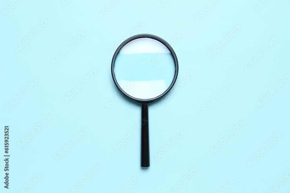 Black magnifier on blue background