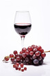 © © Raymond Orton - wineglass with some red wine and ripe grapes, on a white background, copy space,  Created using generative AI tools.