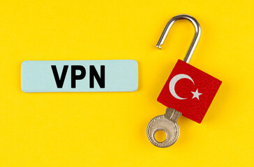 Poster - On the yellow surface is an open lock with a key and a sticker with the inscription - VPN