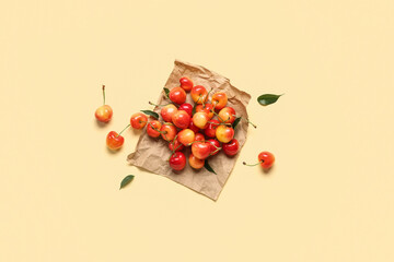 Wall Mural - Paper with sweet cherries on light background