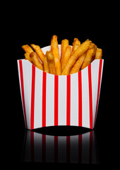 Wall Mural - Southern french fries in paper container on black background