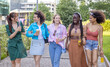 © Andrea Vumbaca Photo - Group of happy multicultural young female friends laughing together outdoors