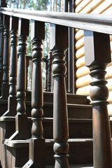 Wall Mural - railing of a wooden staircase outside a wooden building