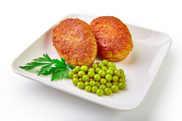 Wall Mural - Two fried breaded cutlet with lettuce and parsley isolated on white background