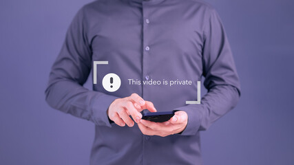 Poster - Young man using a smartphone to play social media but this video is blocked or privacy settings have been set. Searching for more internet, and search engine optimization. Subscribing and following.
