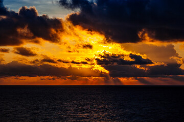 Canvas Print - Photo of a dramatic cloudy sunset over the ocean.