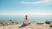 A White Woman Is Meditating On The Beach With Water In Front Of Her Generative AI