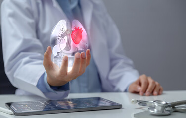 Doctor examining heart with hologram in hand. The concept of using modern technology to help diagnose, treat, and maintain heart health.