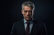 © Rudsaphon - Portrait of mature businessman in suit looking at camera on black background.Generative Ai