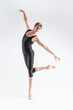 © danmorgan12 - Modern Ballet Dancing. Contemporary Art Ballet of Young Caucasian Athletic Man in Black Suit Dancing in Studio