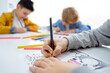 © Chiralli - Children drawing paint with colorful pencils coloring book in educational class at school. Art creative lessons developing imagination fine motor skills