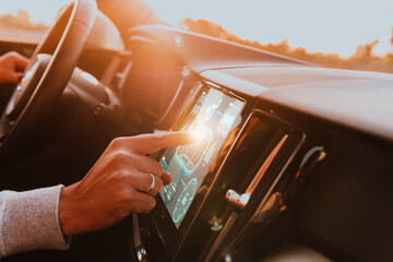 Close-up of a man's finger adjusting autopilot on the touch screen