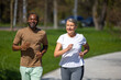 © zinkevych - Mature couple jogging in the park together