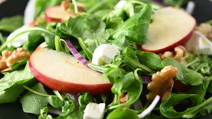Sticker - Autumn salad with apples and walnuts rotating footage.