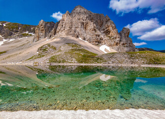 Monte Redentore and Pilato lake (Italy) - The landscape summit of Mount Redentore with Pilato lake, between the regions Umbria and Marche. One of the highest peaks of the Apennines, in Monti Sibillini