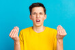 © Tetiana - Young caucasian man wear shirt against blue background angry gesturing typical italian gesture with hand looking to camera