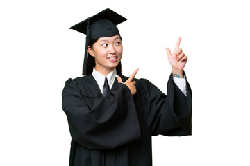 Wall Mural - Young university graduate Asian woman over isolated background pointing with the index finger a great idea