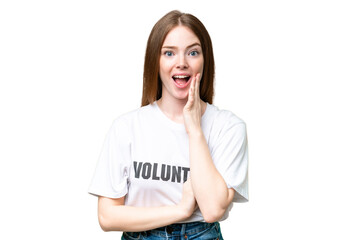 Wall Mural - Young volunteer woman over isolated chroma key background with surprise and shocked facial expression