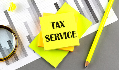 Wall Mural - TAX SERVICE text on sticky on sticky on chart with pen