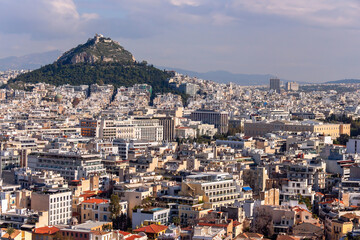  Aerial panorama of Athens city with parlament building and Mount Lycabettus (Lykavittos). Athens, Greece