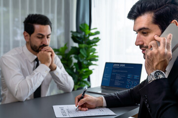 Candidate feeling dissatisfied and lose confidence during job interview as interviewer talk on the phone, ignoring and showing disinterest. Negative interview experience for applicant. Fervent