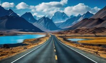  A Long Road With A Lake In The Middle Of It And Mountains In The Distance With Clouds In The Sky Above It And A Body Of Water In The Foreground.  Generative Ai