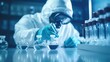 © masyastadnikova - A chemist is doing laboratory chemical research with reagents and flasks. Scientific chemical research