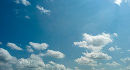 Wall Mural - View of Blue Skies With Partly Clouded White Clouds on a Spring Day