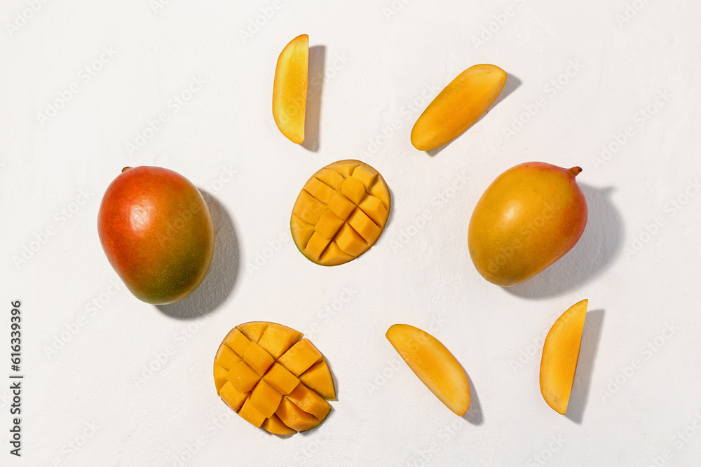 Fresh ripe mangoes on white  background
