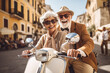 Retired happy couple on a scooter in a Mediterranean country on a vacation. Pension plan . High quality photo