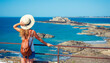 © M.studio - Young woman looking at atlantic ocean coast and fort- Saint Malo in France, travel destination, tour tourism,vacation concept