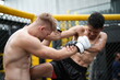 © FotoArtist - Two professional boxers fighting at the gym