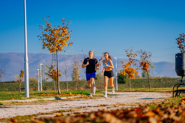 Wall Mural - A front view photo of two guys running