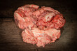 Pink brain raw before cooking on a wooden table. Raw fresh brain of a mammalian animal, a cow. Raw meat. Gut. Copy space