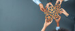 © InfiniteFlow - Panoramic shot top view of business people holding cog wheel as unity and teamwork in corporate workplace concept. Office worker colleague with symbol of visionary system for business success. Concord